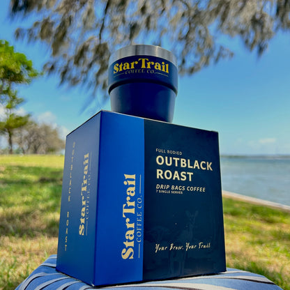 Star Trail Coffee Co. Outblack Roast coffee packaging with a scenic background