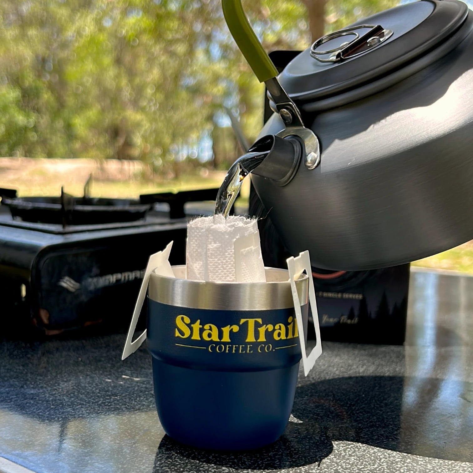 Star Trail Coffee Co. product being used outdoors with a natural background